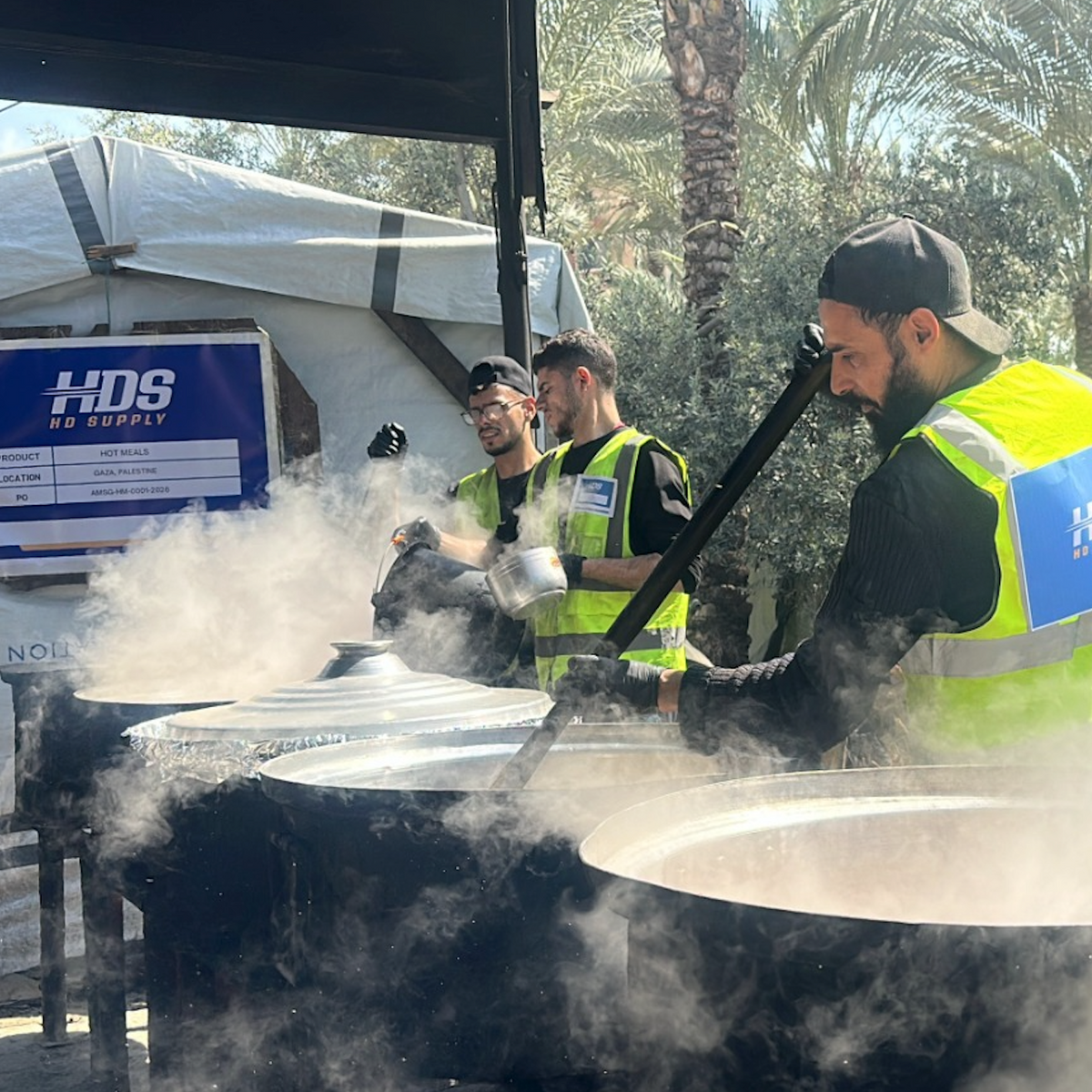 Aid workers preparing hot meals for families in Palestine