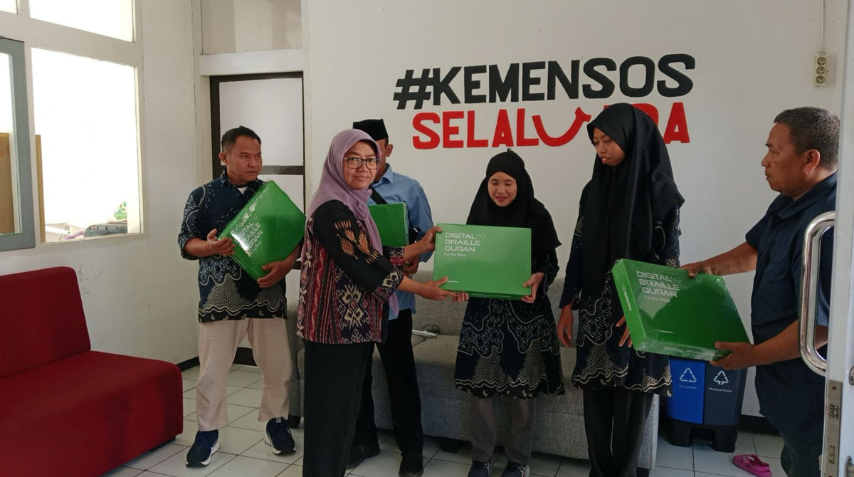 Braille Qur'ans being presented to visually impaired recipients in Indonesia